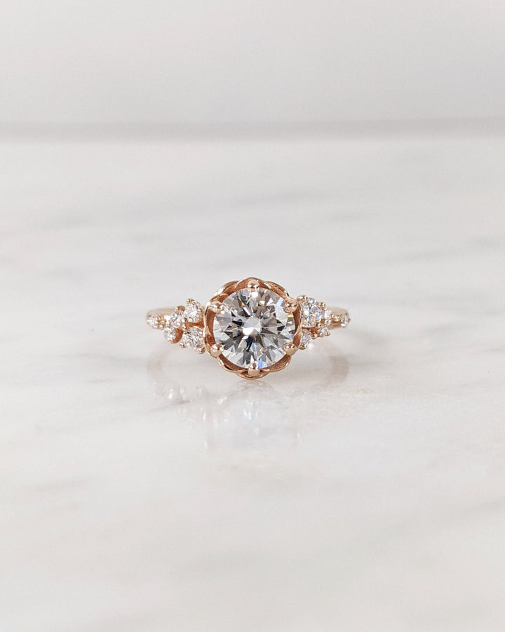 Round cut diamond ring worn on hand