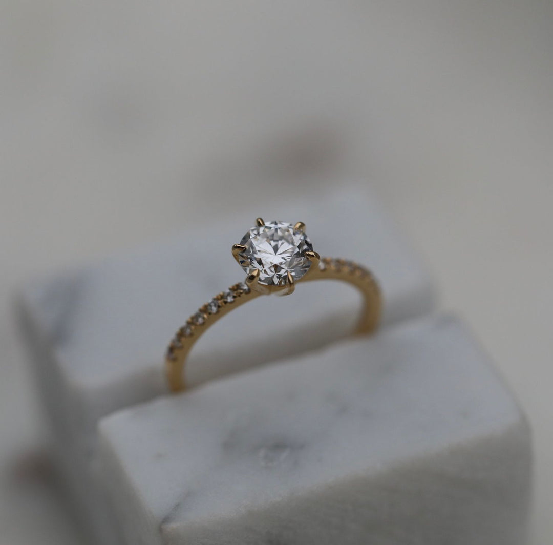 Macro shot of round cut diamond facets in solitaire ring setting