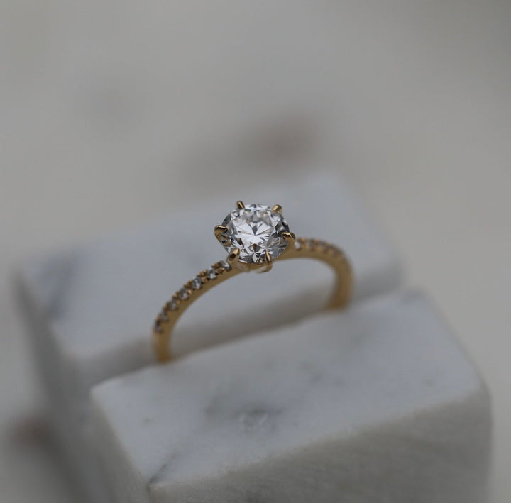 Macro shot of round cut diamond facets in solitaire ring setting