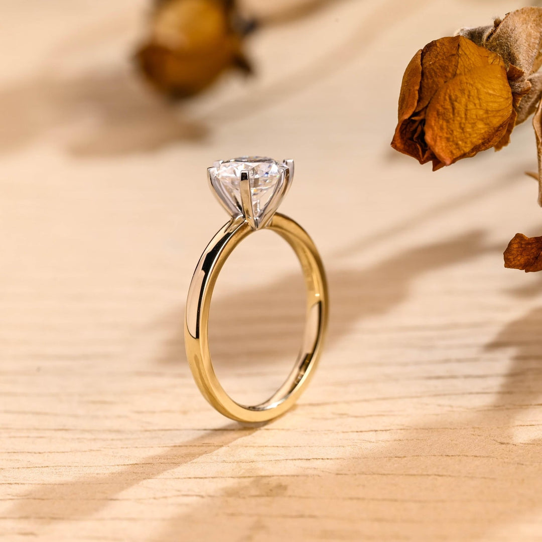 Round cut engagement ring shown with authenticity certificate