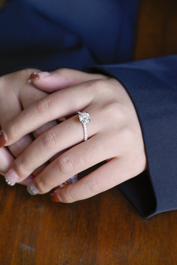 Round cut engagement ring side view showing band detail