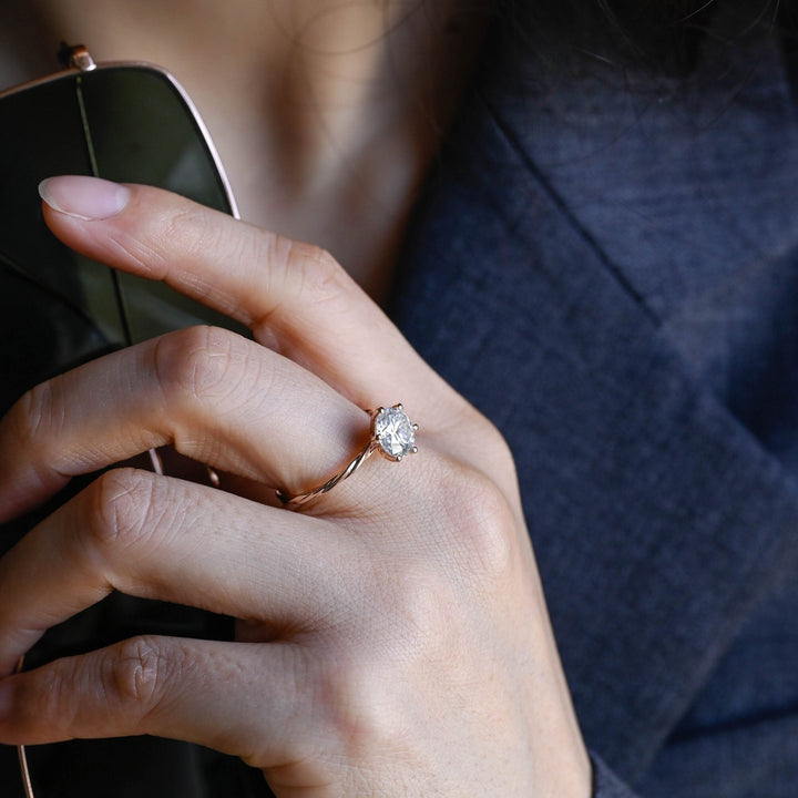 Certified round cut diamond featured in solitaire engagement ring