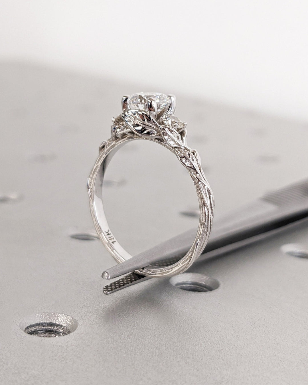 Premium round cut three stone engagement ring crafted in solid gold