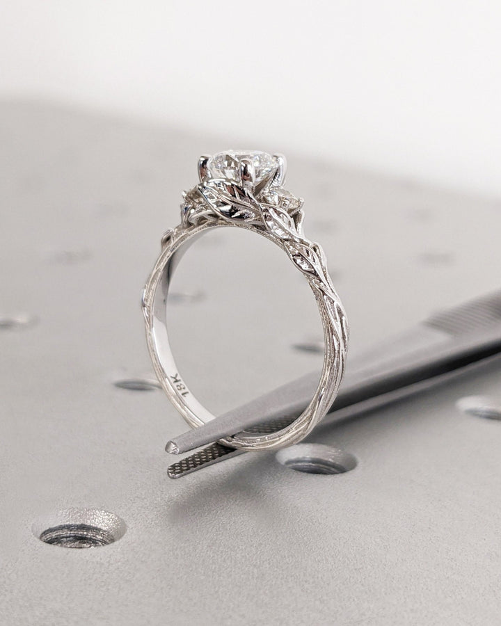 Premium round cut three stone engagement ring crafted in solid gold