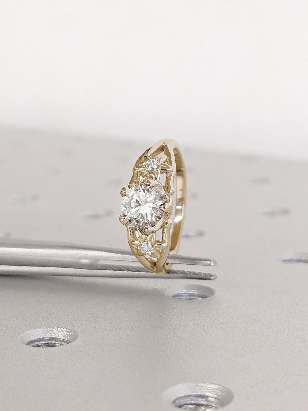Unboxing view of round cut solitaire diamond engagement ring