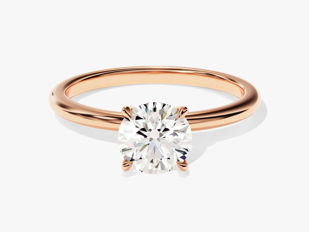 Round solitaire engagement ring offered in gold and platinum