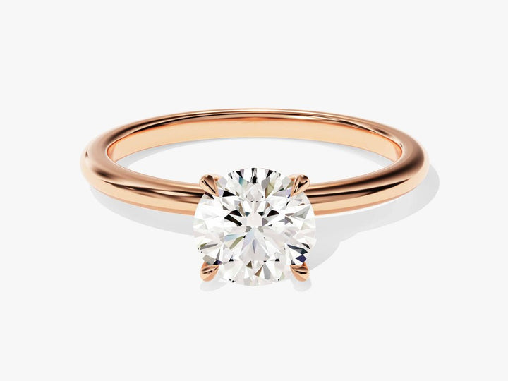 Round solitaire engagement ring offered in gold and platinum