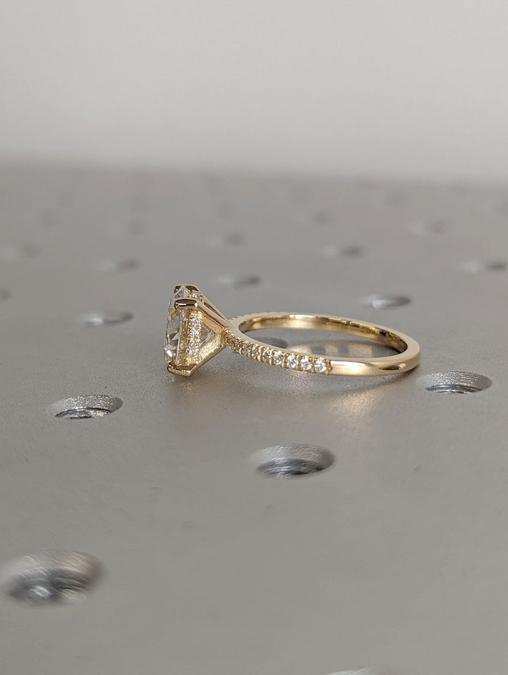 Round cut engagement ring side view showing band detail