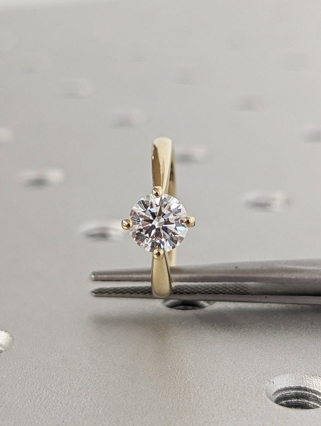 Round solitaire lab grown diamond ring side profile in gold setting