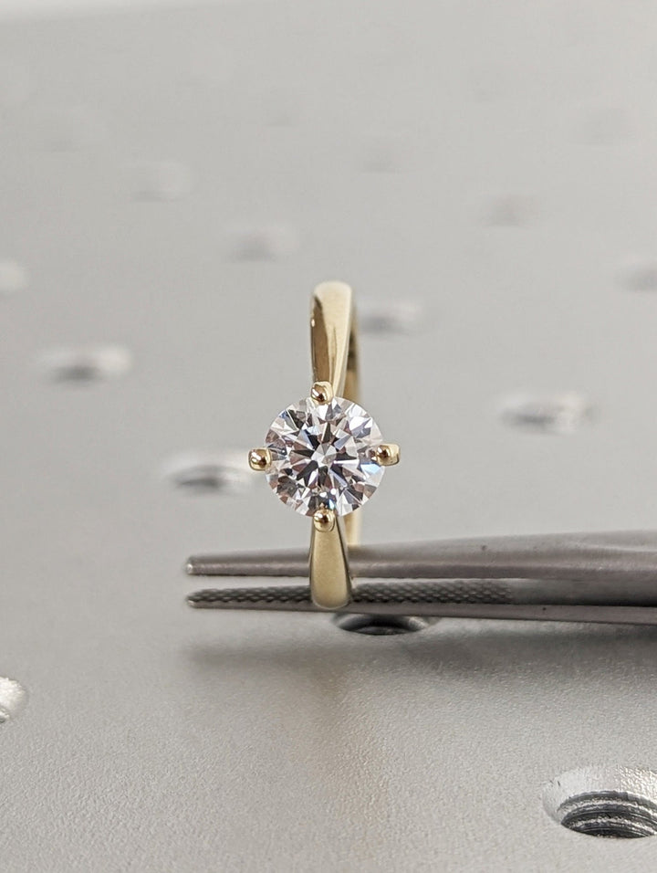 Round solitaire lab grown diamond ring side profile in gold setting