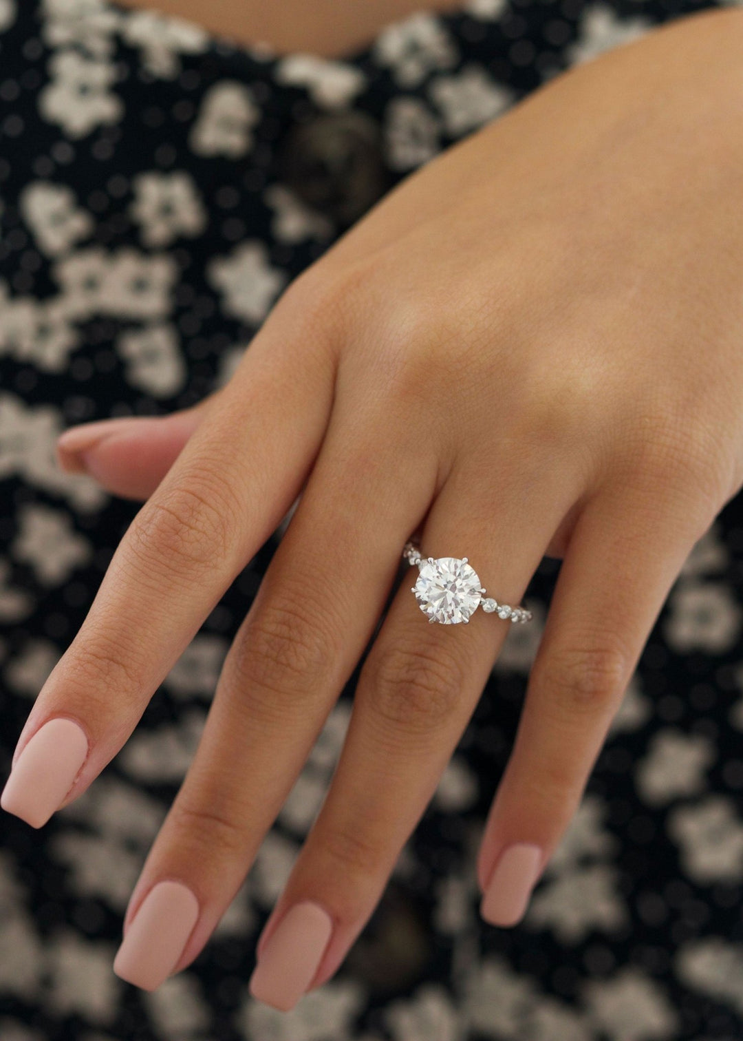 Round pave diamond ring presented in signature gift packaging