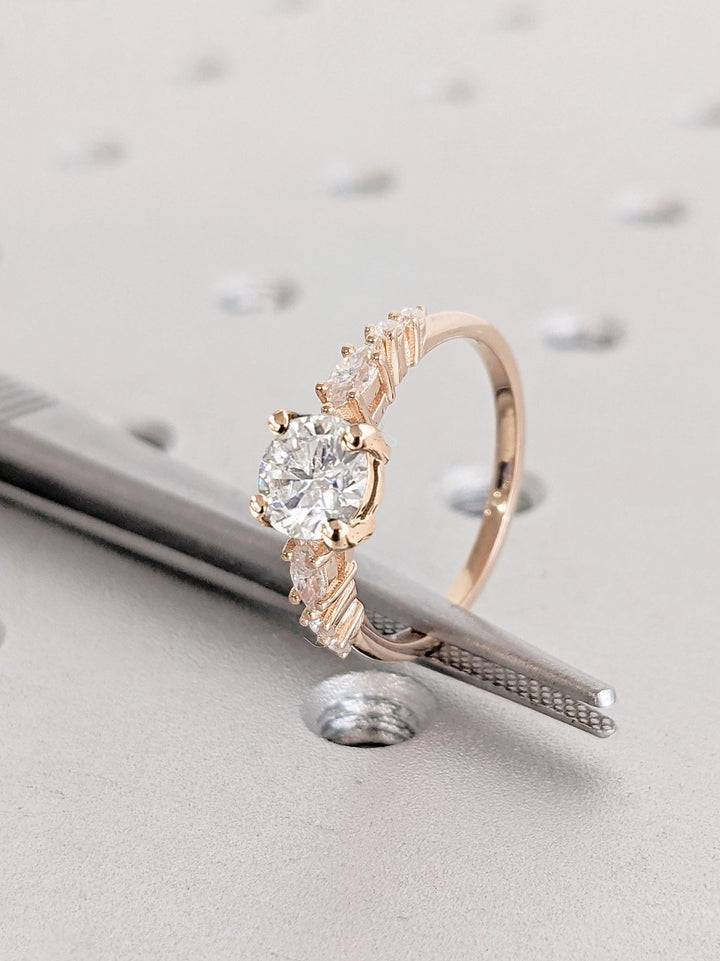 Round cluster engagement ring viewed from the side