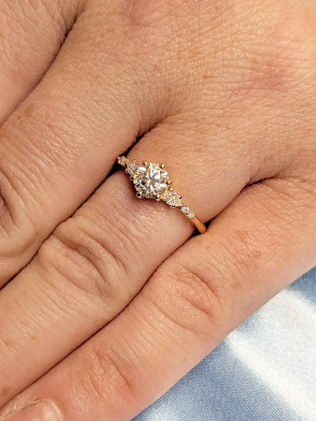 Round cluster engagement ring close-up showing high clarity diamond clarity