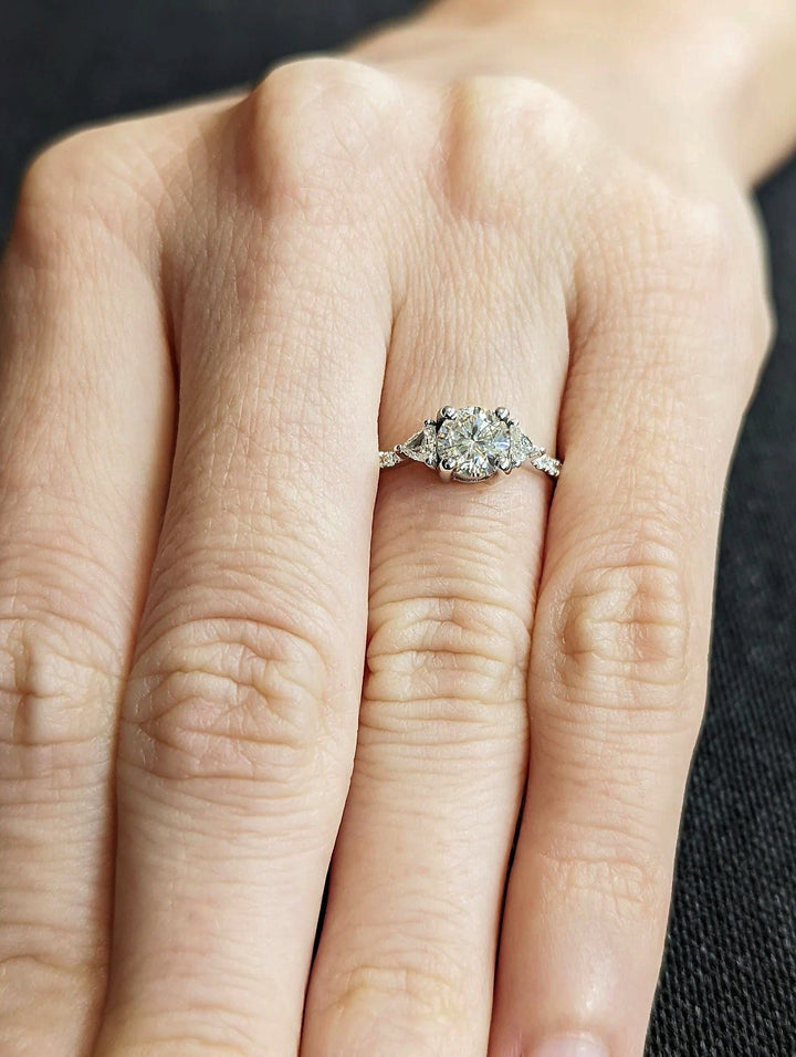 Detailed close-up of round pave diamond engagement ring