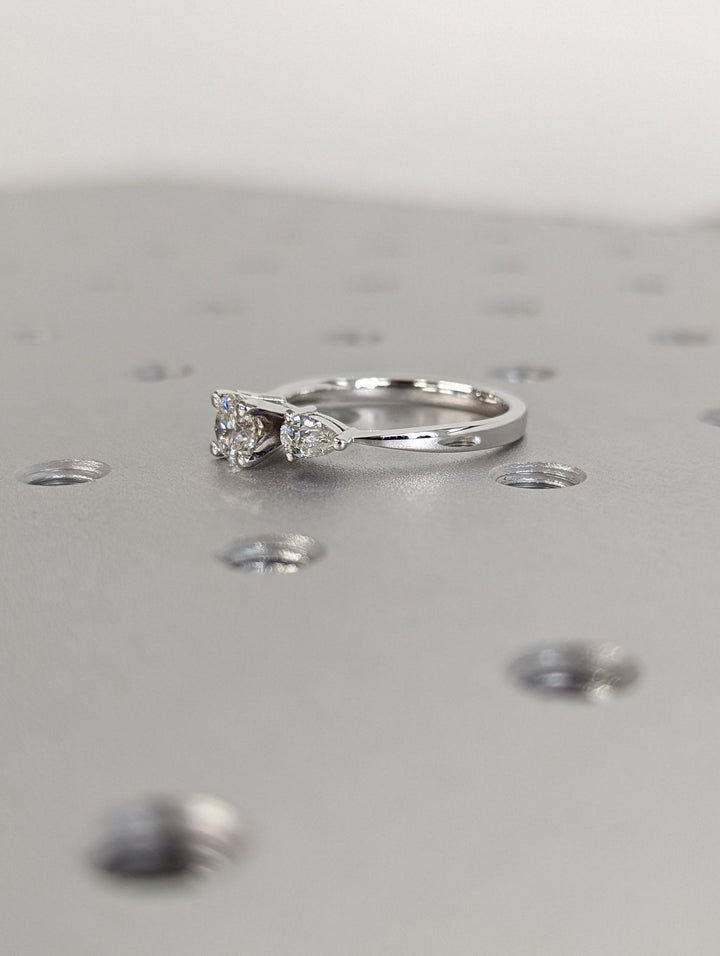 Round cut engagement ring side view showing band detail
