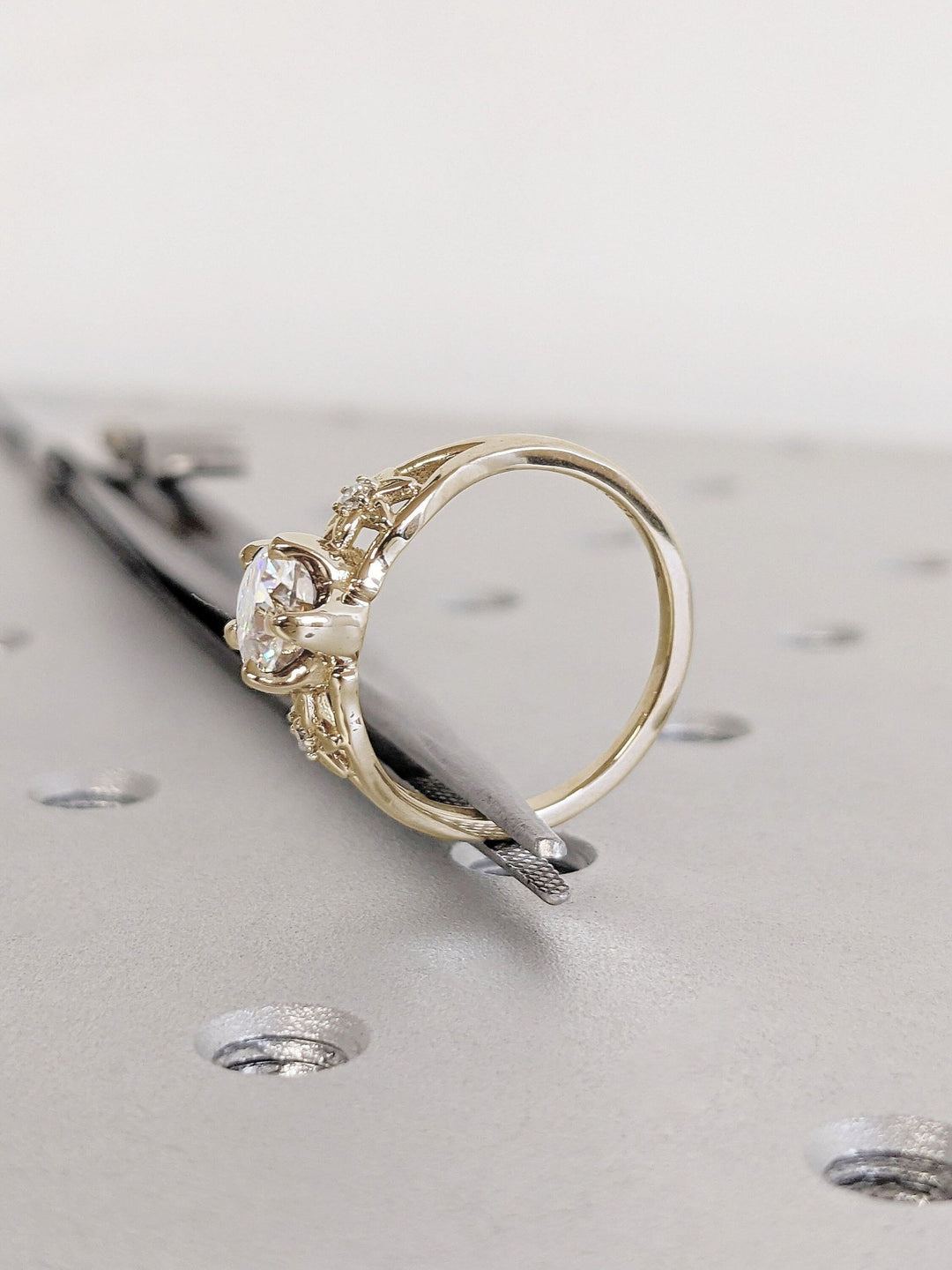Round solitaire diamond ring presented in signature gift packaging