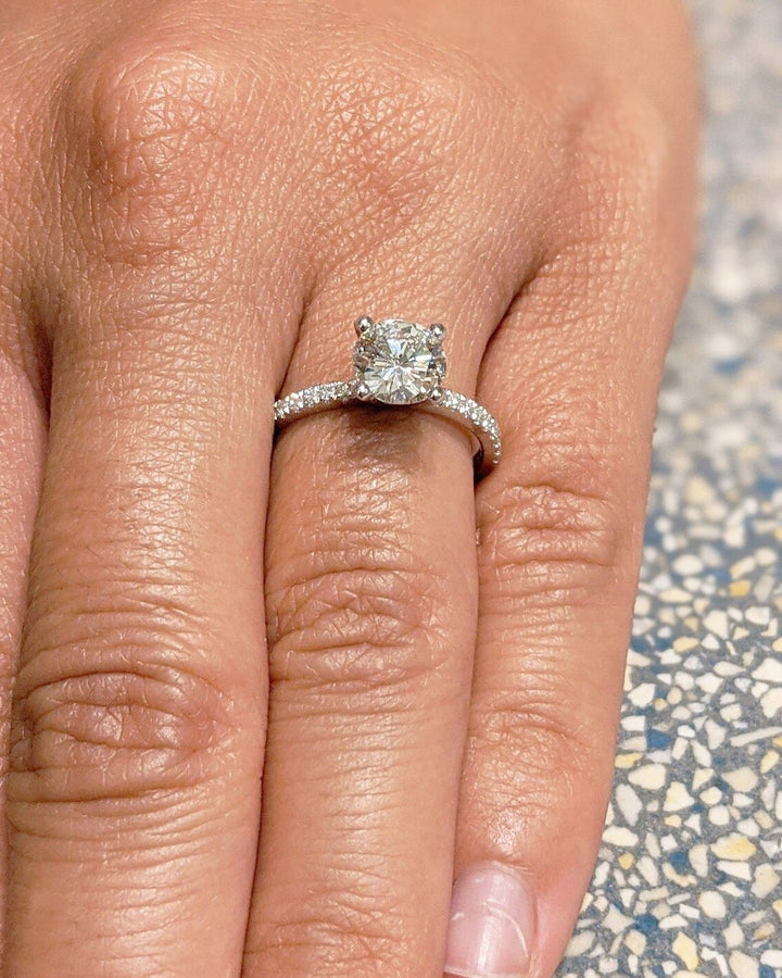 Top-down view of round cut pave engagement ring