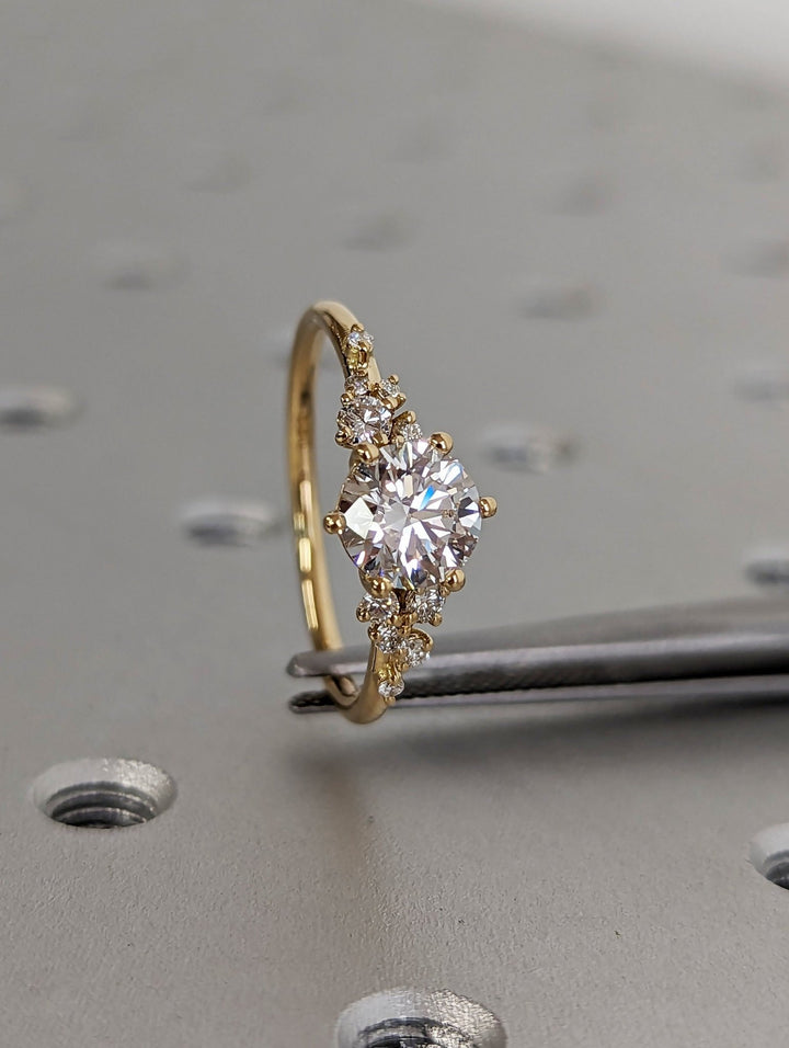 Round cluster engagement ring with IGI certificate and packaging