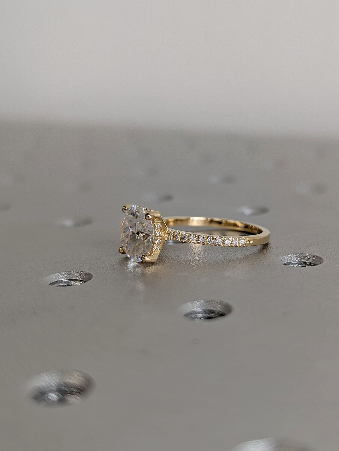 Premium round cut hidden halo engagement ring crafted in solid gold