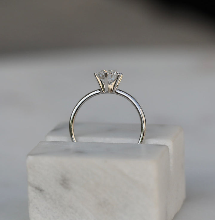 Round solitaire engagement ring with IGI certificate and packaging
