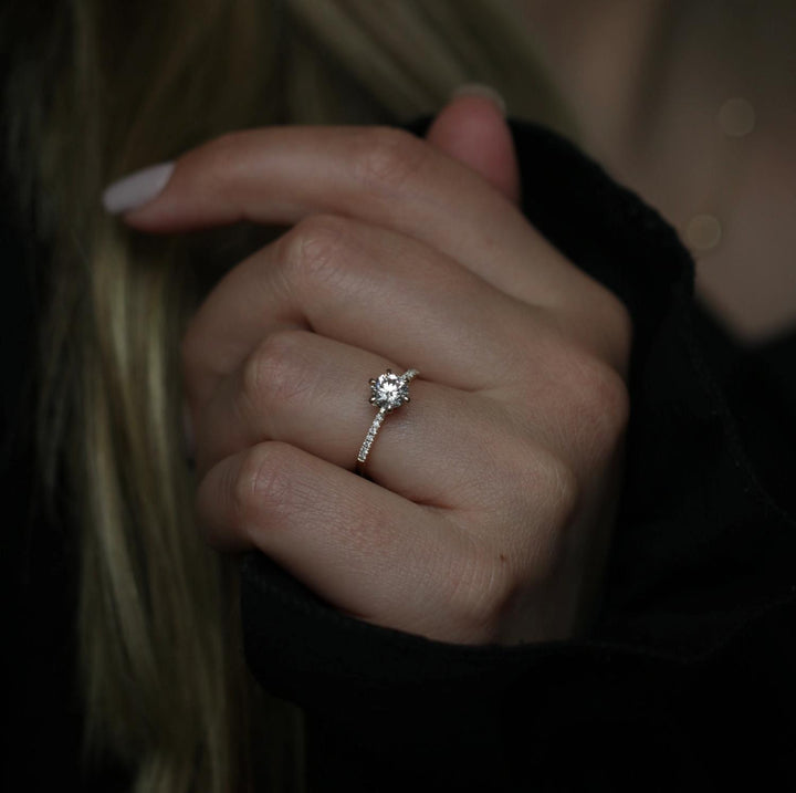 Profile view of round cut solitaire engagement ring band