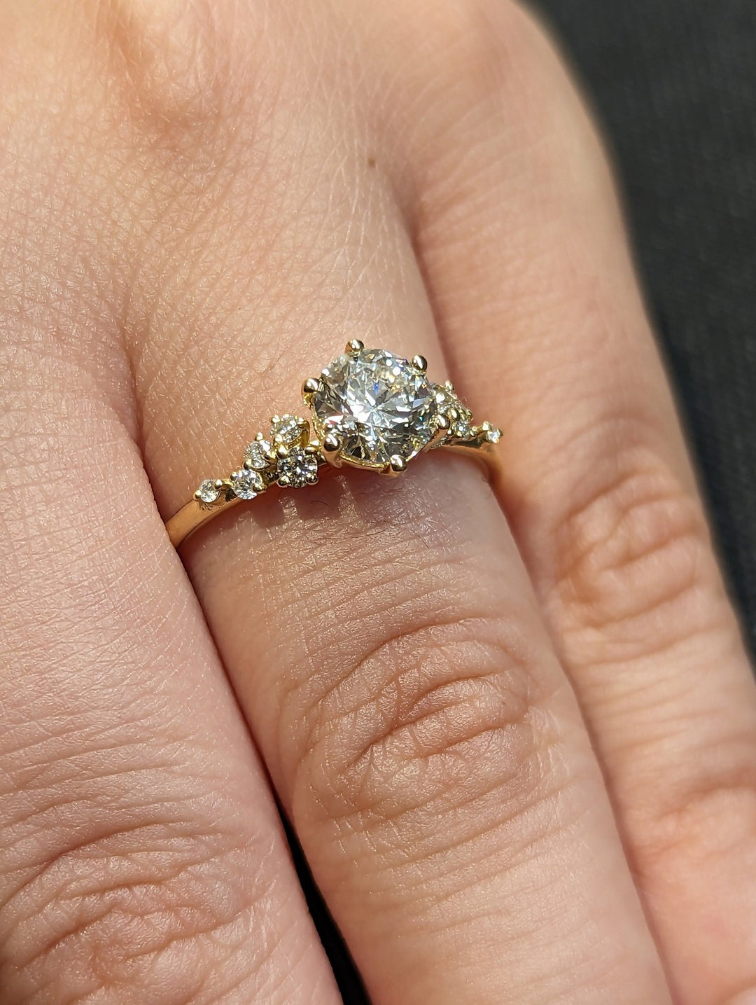 Round cluster diamond ring presented in signature gift packaging