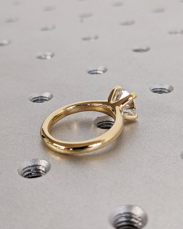 Macro shot of round cut diamond facets in solitaire ring setting