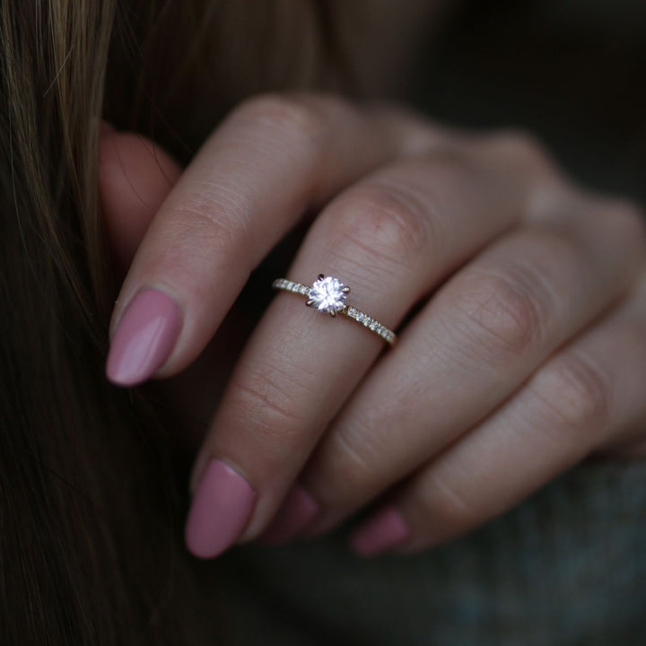 Round solitaire diamond engagement ring available in multiple metals
