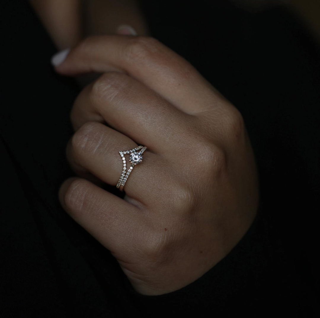 Angled view of round cut diamond in solitaire setting