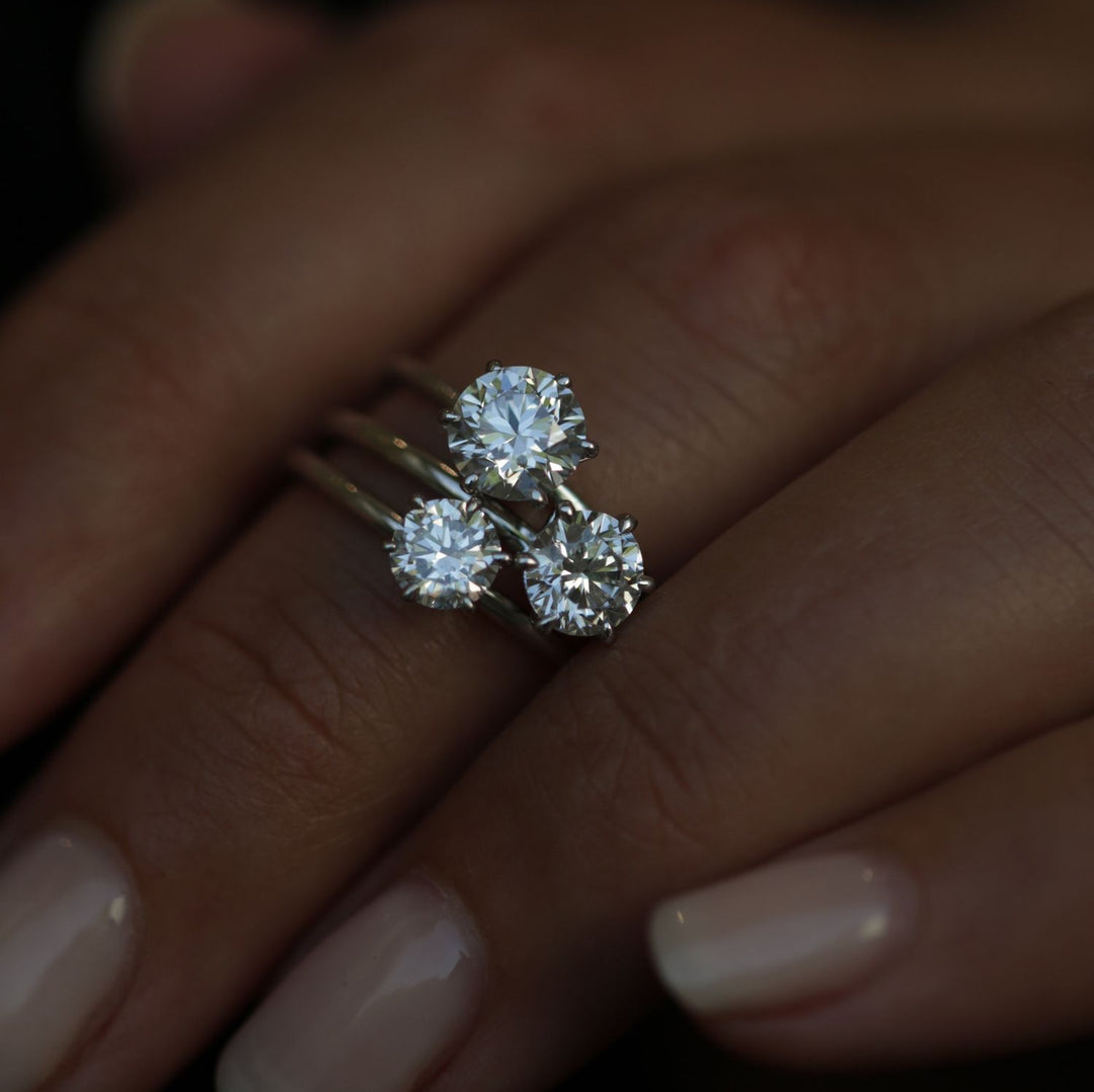 Round solitaire engagement ring with IGI certificate and packaging
