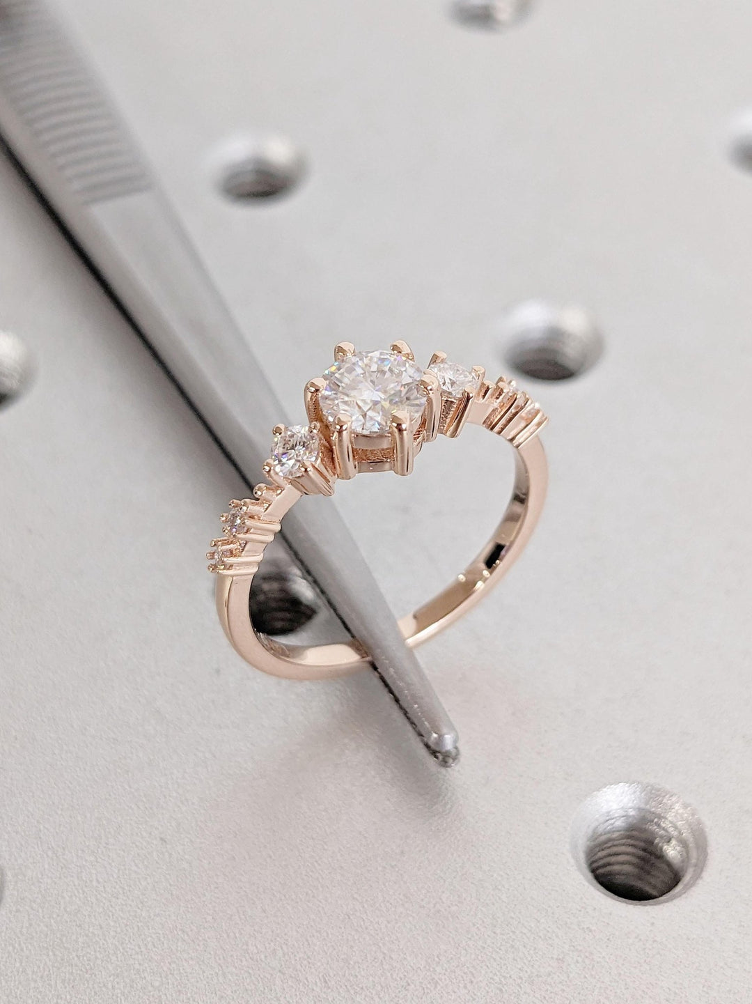 Fine craftsmanship detail on round cluster engagement ring