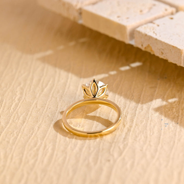Round solitaire engagement ring viewed from the side