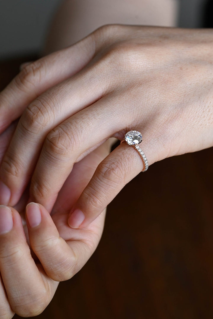Macro shot of round cut diamond facets in pave ring setting