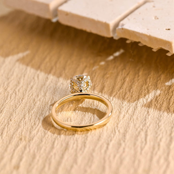 Round cut engagement ring shown with authenticity certificate