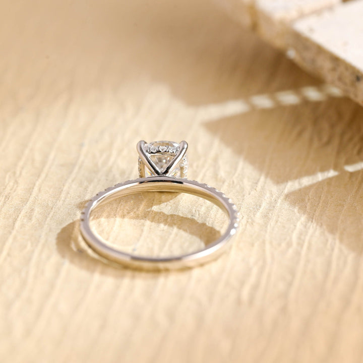 Close-up of round cut center diamond in hidden halo engagement ring