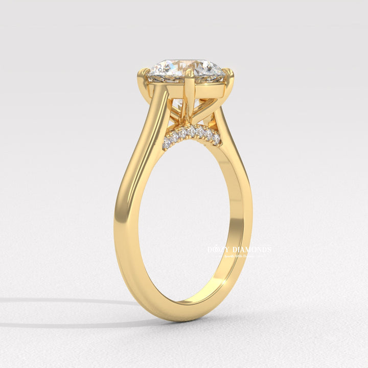 Detailed close-up of round solitaire diamond engagement ring