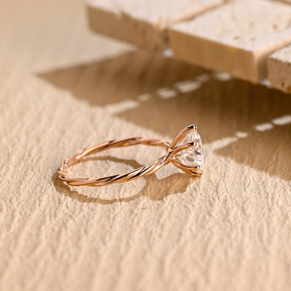 Round cut solitaire engagement ring shown in real-life wear