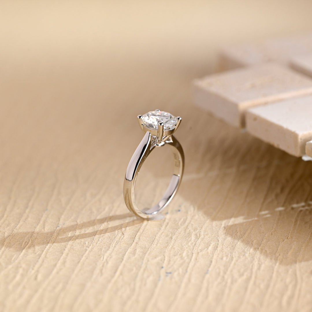 Round solitaire engagement ring finished in polished solid gold