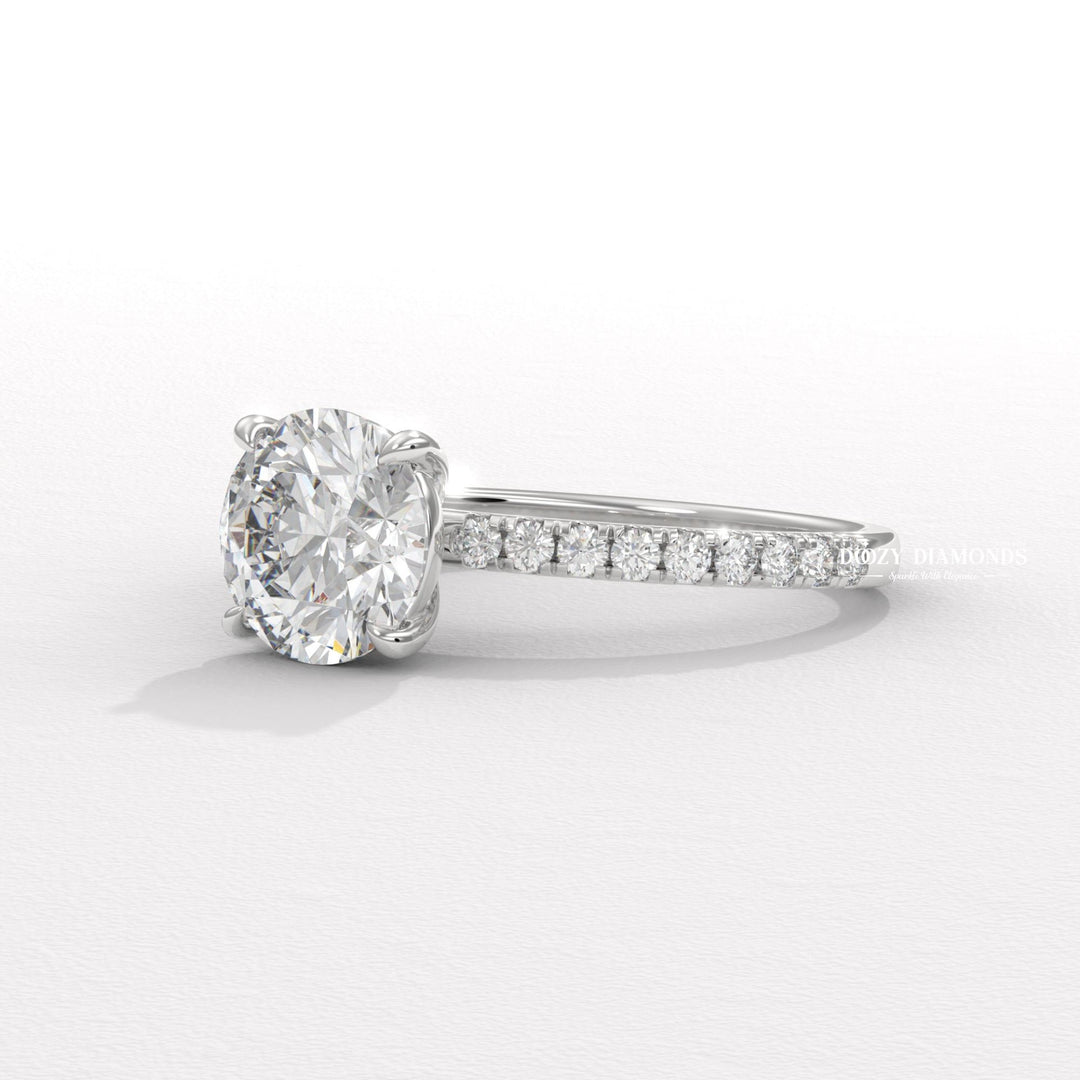 Detailed close-up of round pave diamond engagement ring