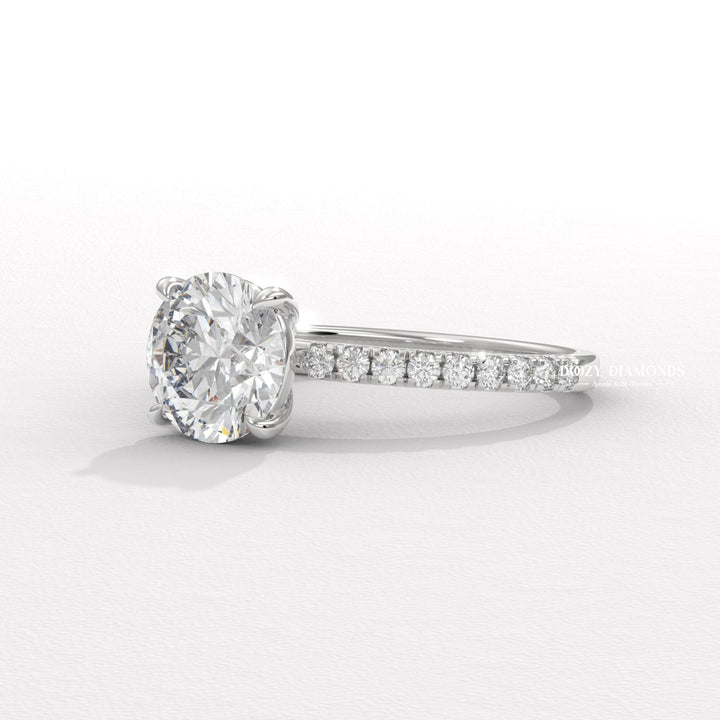Detailed close-up of round pave diamond engagement ring