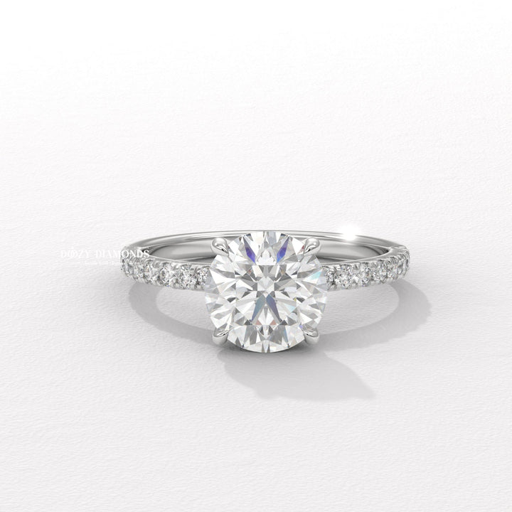 Round pave engagement ring close-up highlighting diamond sparkle