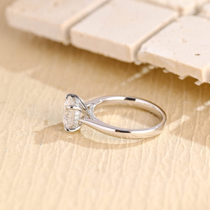 Round hidden halo diamond ring presented in signature gift packaging