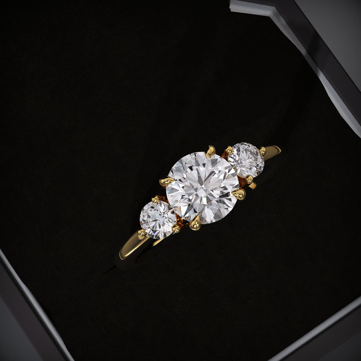 Round cut three stone engagement ring available to buy now
