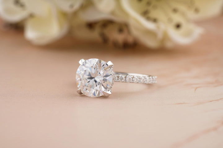 Macro shot of round cut diamond facets in hidden halo ring setting