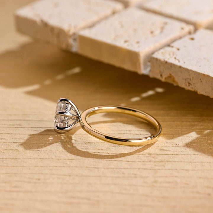 Fine craftsmanship detail on round hidden halo engagement ring