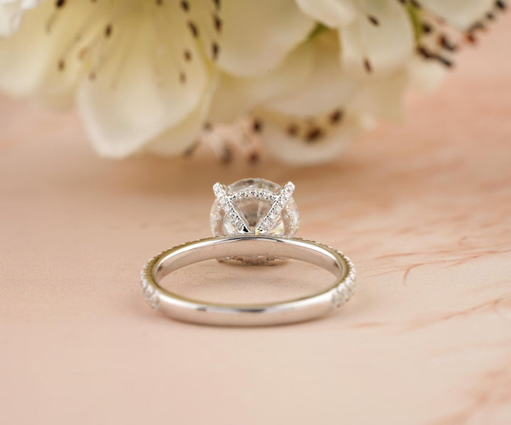 Round cut hidden halo engagement ring with IGI certified center diamond