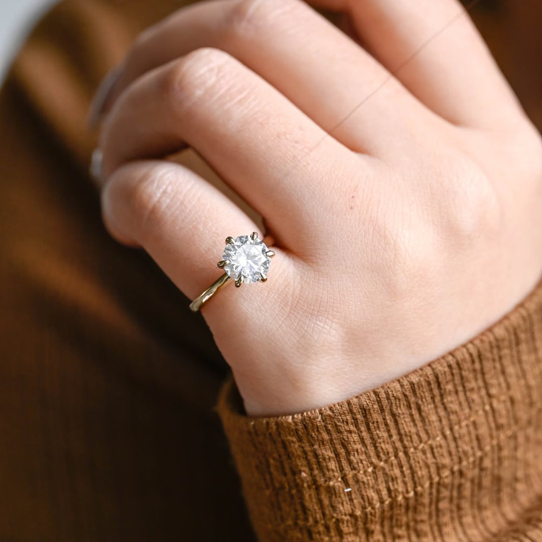 Premium round cut hidden halo engagement ring crafted in solid gold