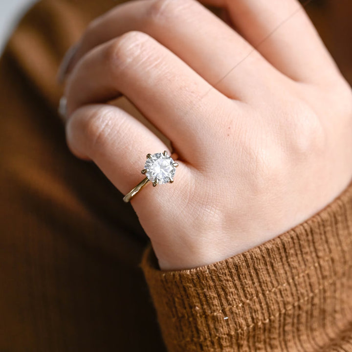 Premium round cut hidden halo engagement ring crafted in solid gold