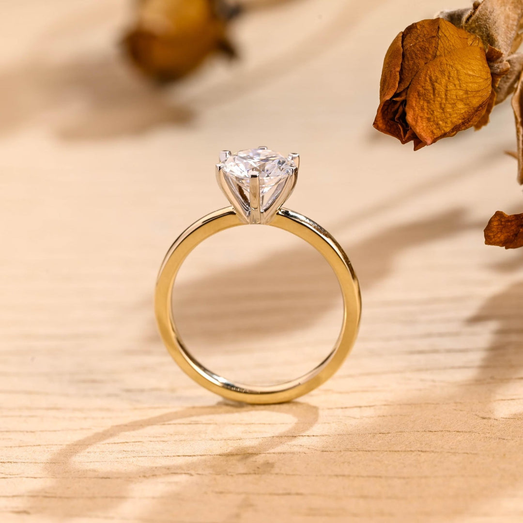 Round solitaire diamond ring presented in signature gift packaging