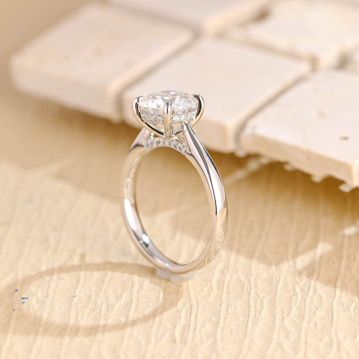 Round cut engagement ring shown with authenticity certificate